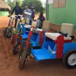 Huy-Liêm with Maurice, one of the volunteers who has been helping distribute the pedal carts throughout Benin.